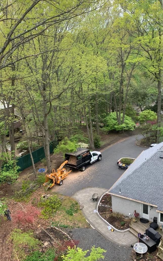 An aerial view of a house with a truck parked in front of it.