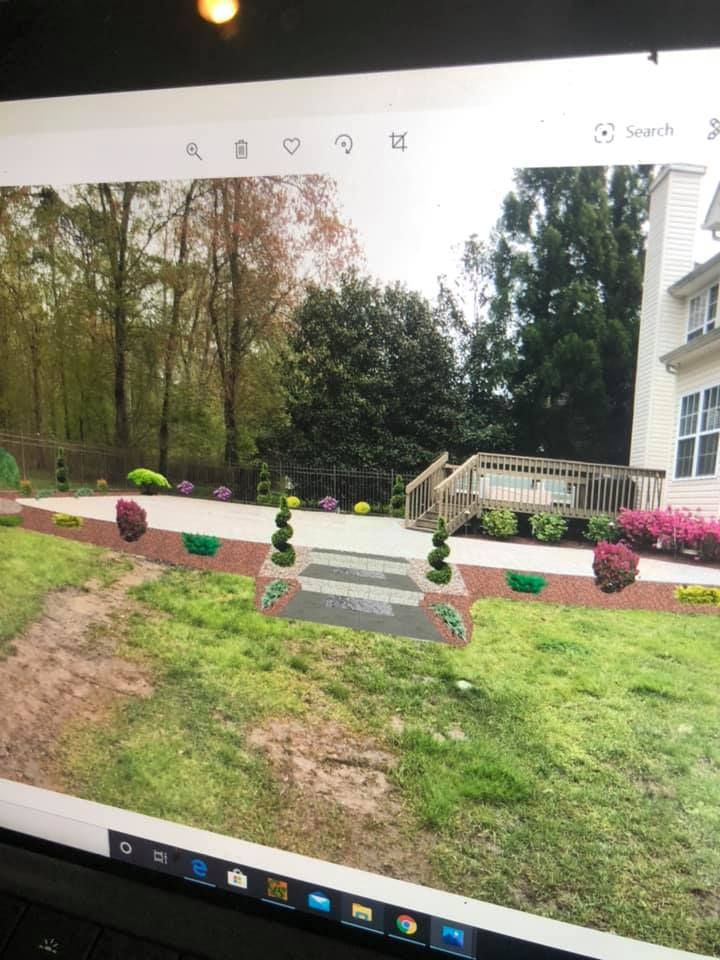 A computer generated image of a backyard with a patio and stairs.