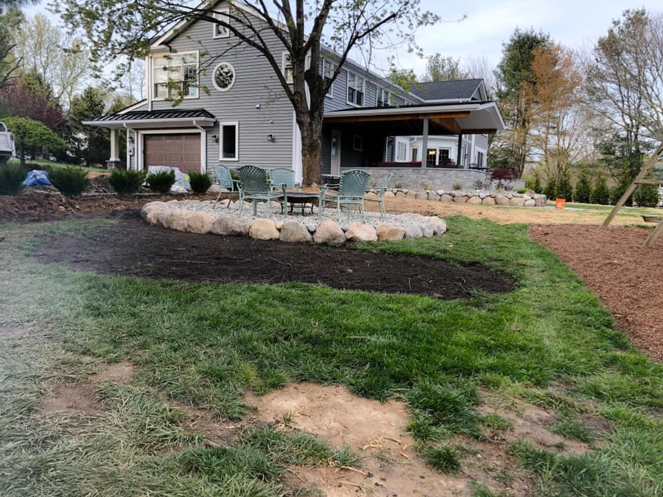 A large house with a large lawn in front of it.