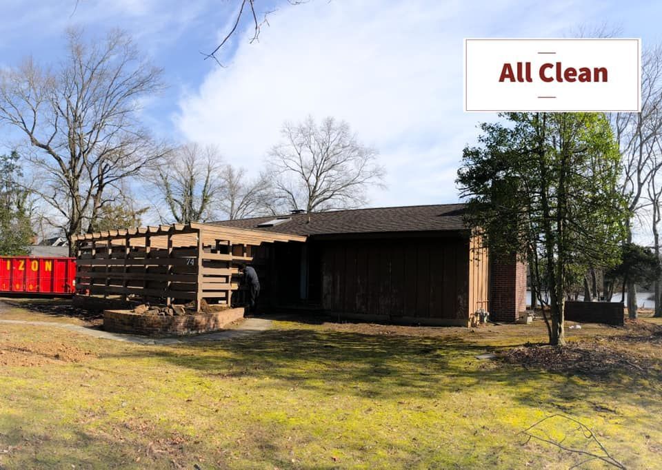A house with leaves on the ground