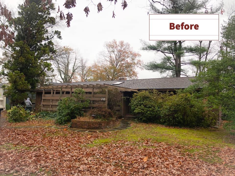 A house with leaves on the ground