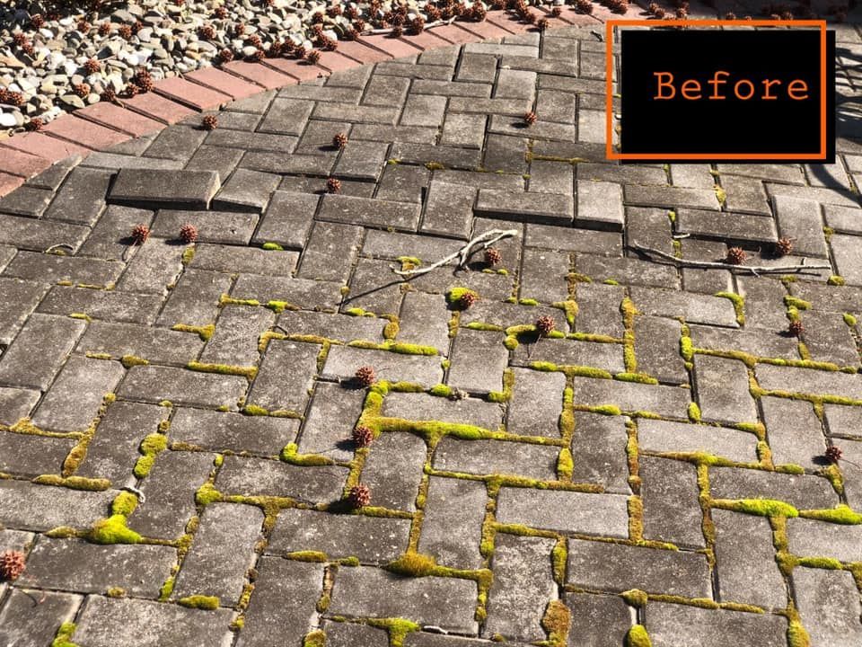 A before picture of a brick walkway 