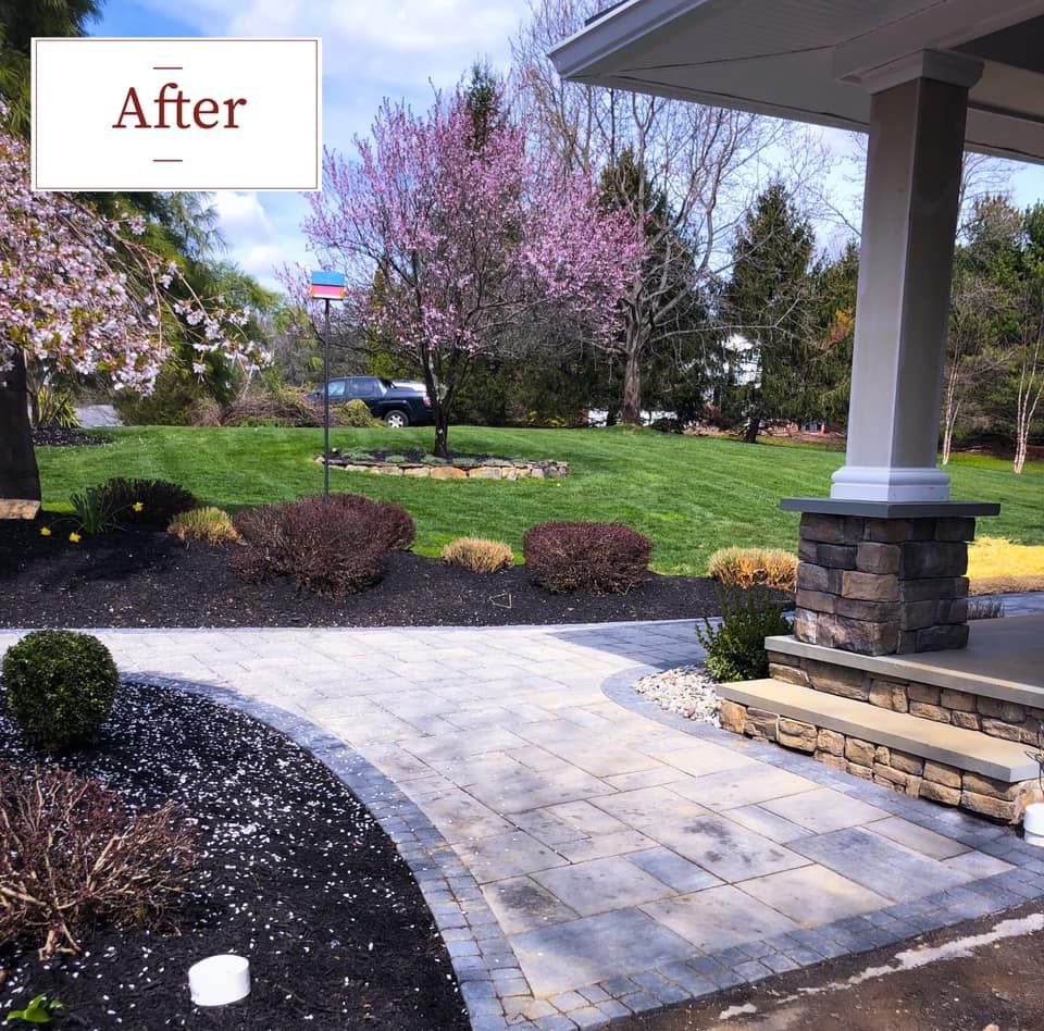 A walkwaly with a beautiful lawn