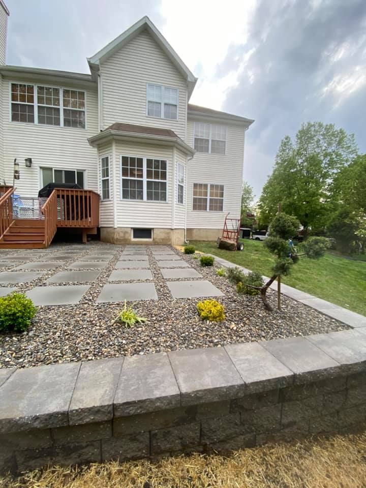 The back of a house with a patio and a deck.