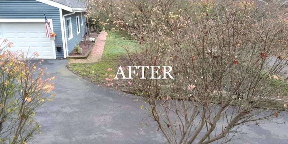A picture of a house and driveway after being remodeled