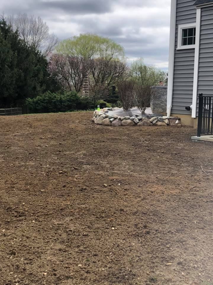 A house with a lot of dirt in front of it.