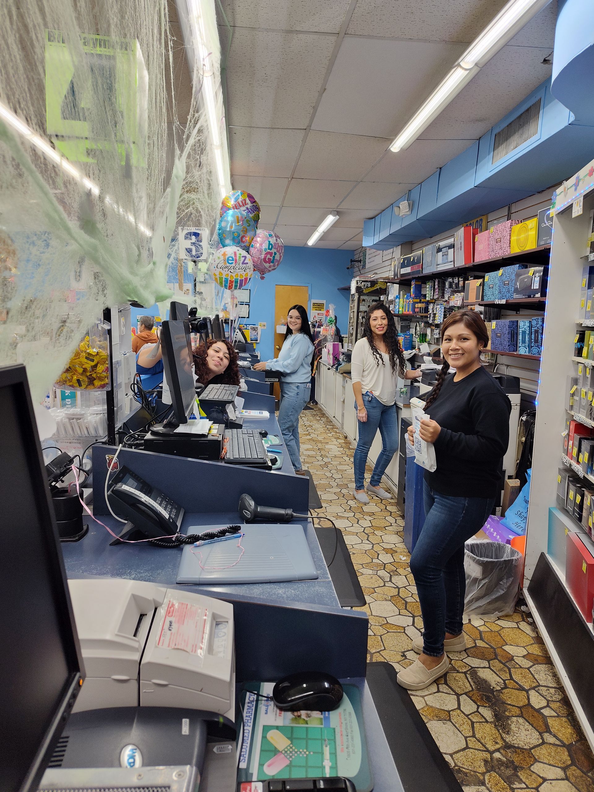 A group of people are standing in a store.