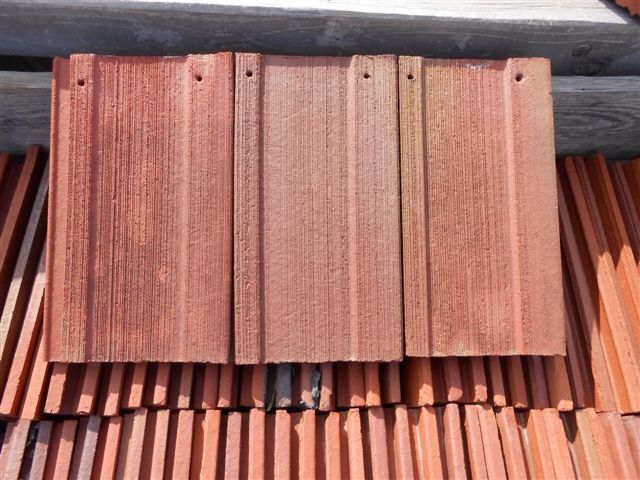 A stack of red tiles sitting on top of each other