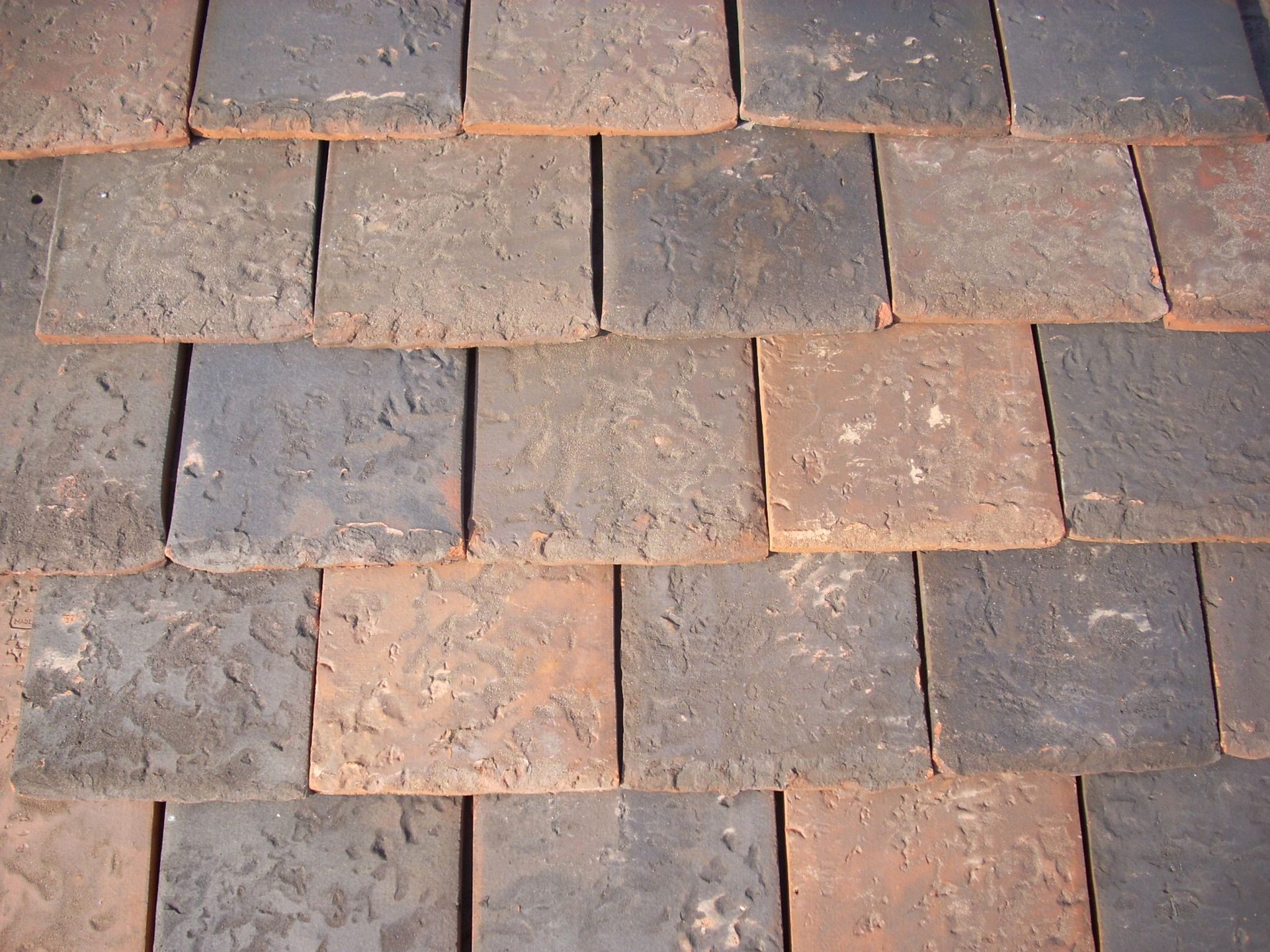 A close up of a roof made of tiles