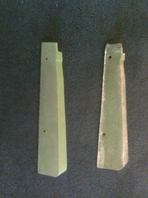 Two pieces of custom roof tile are sitting next to each other