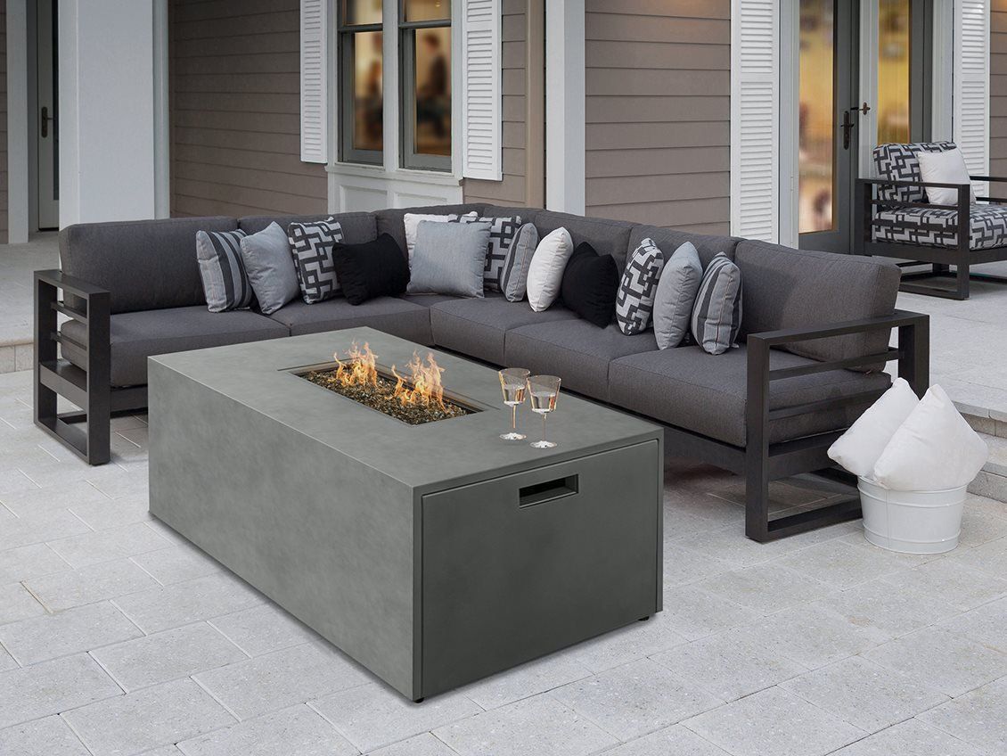 There is a fire pit in the middle of the table.