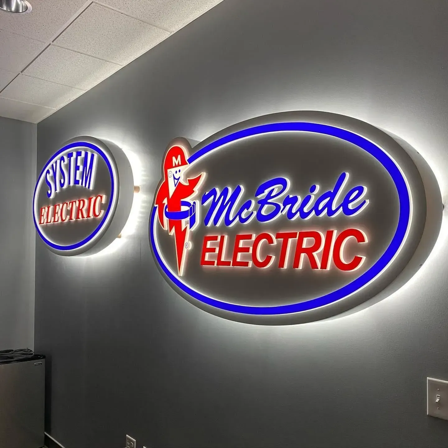 Two illuminated company signs: 