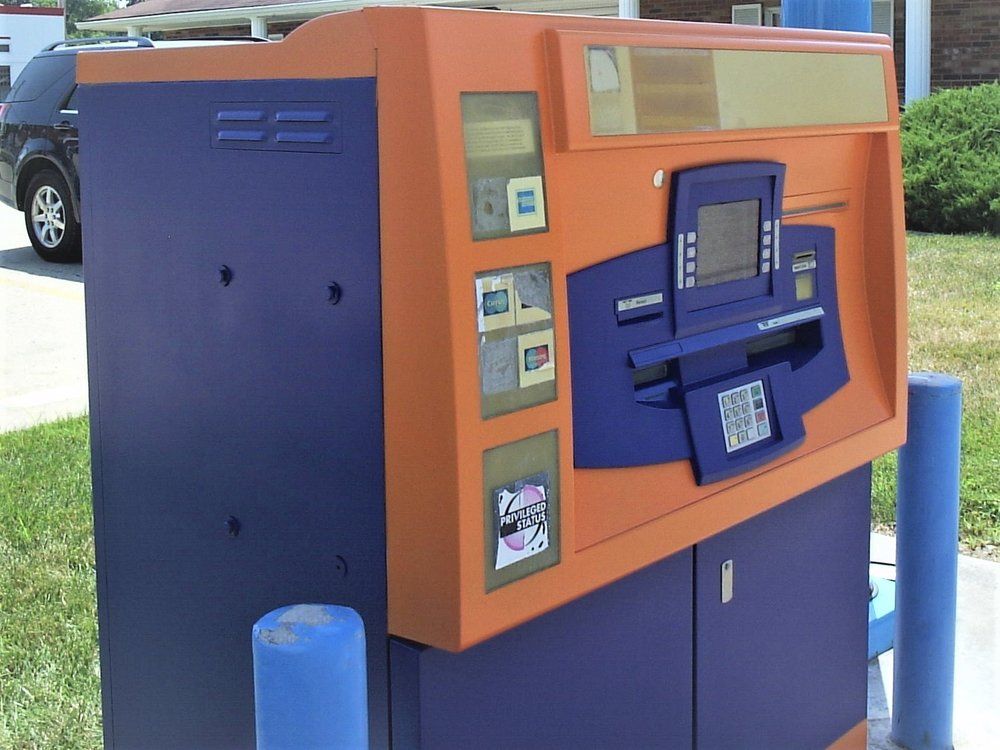 Orange and blue ATM machine