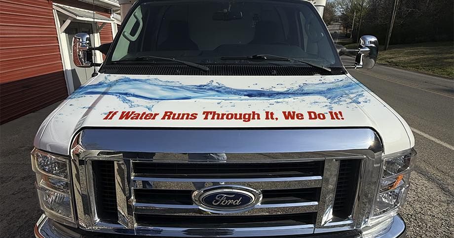 Ford van front with hood sign