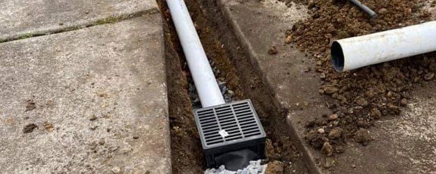Drainage and trenching for landscapes and lawns