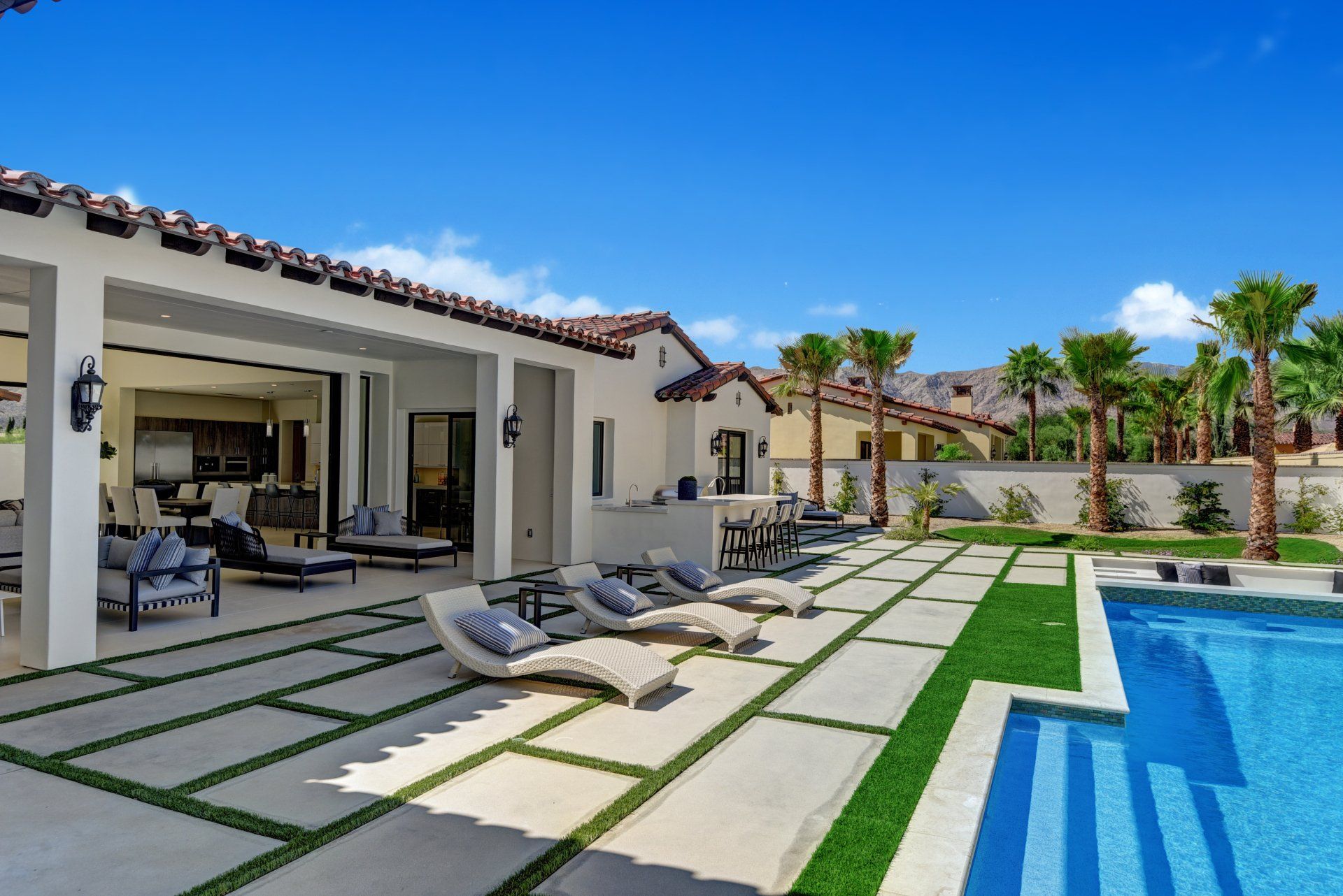 Chaises and pool to mountains