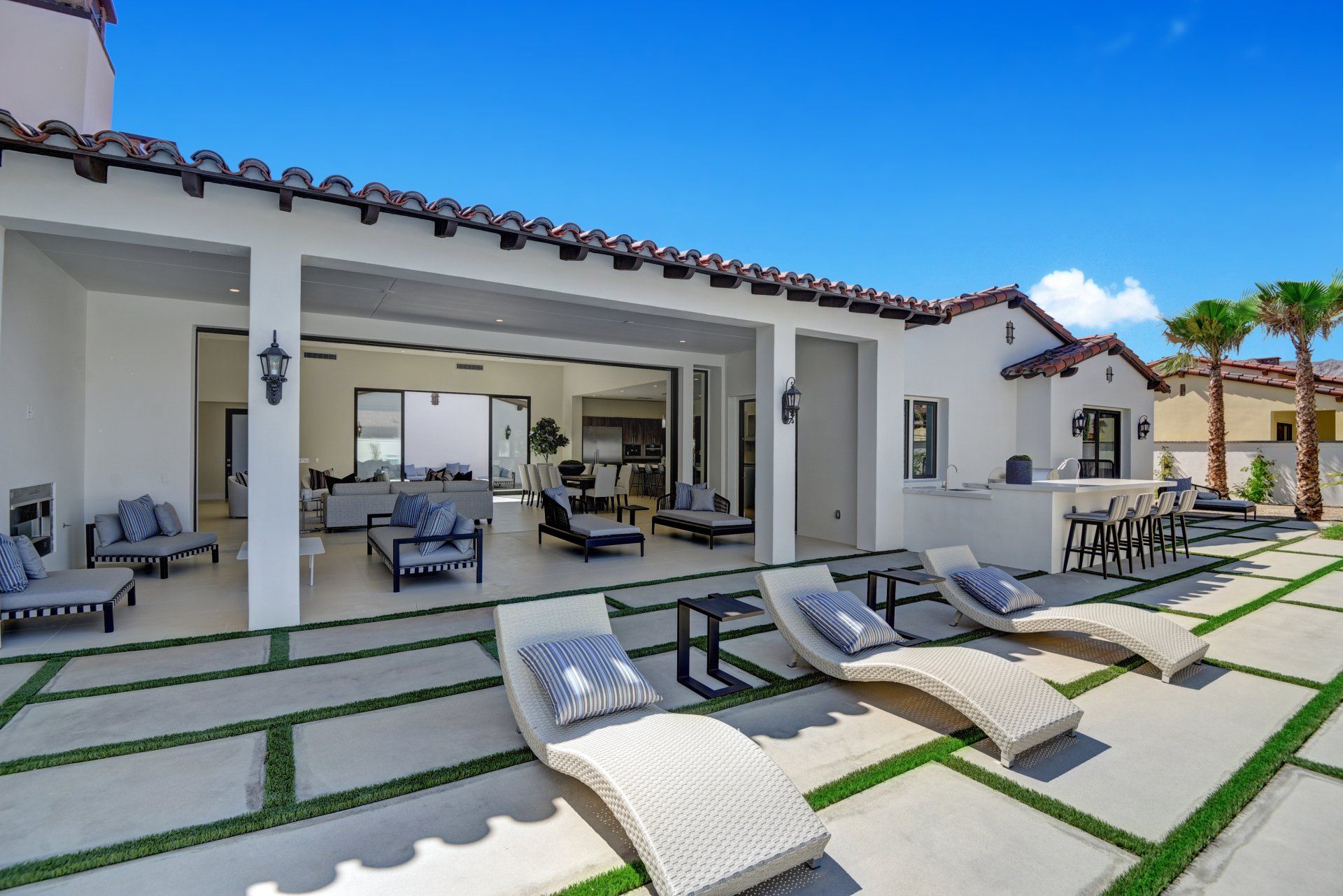 Chaises to covered patio and house