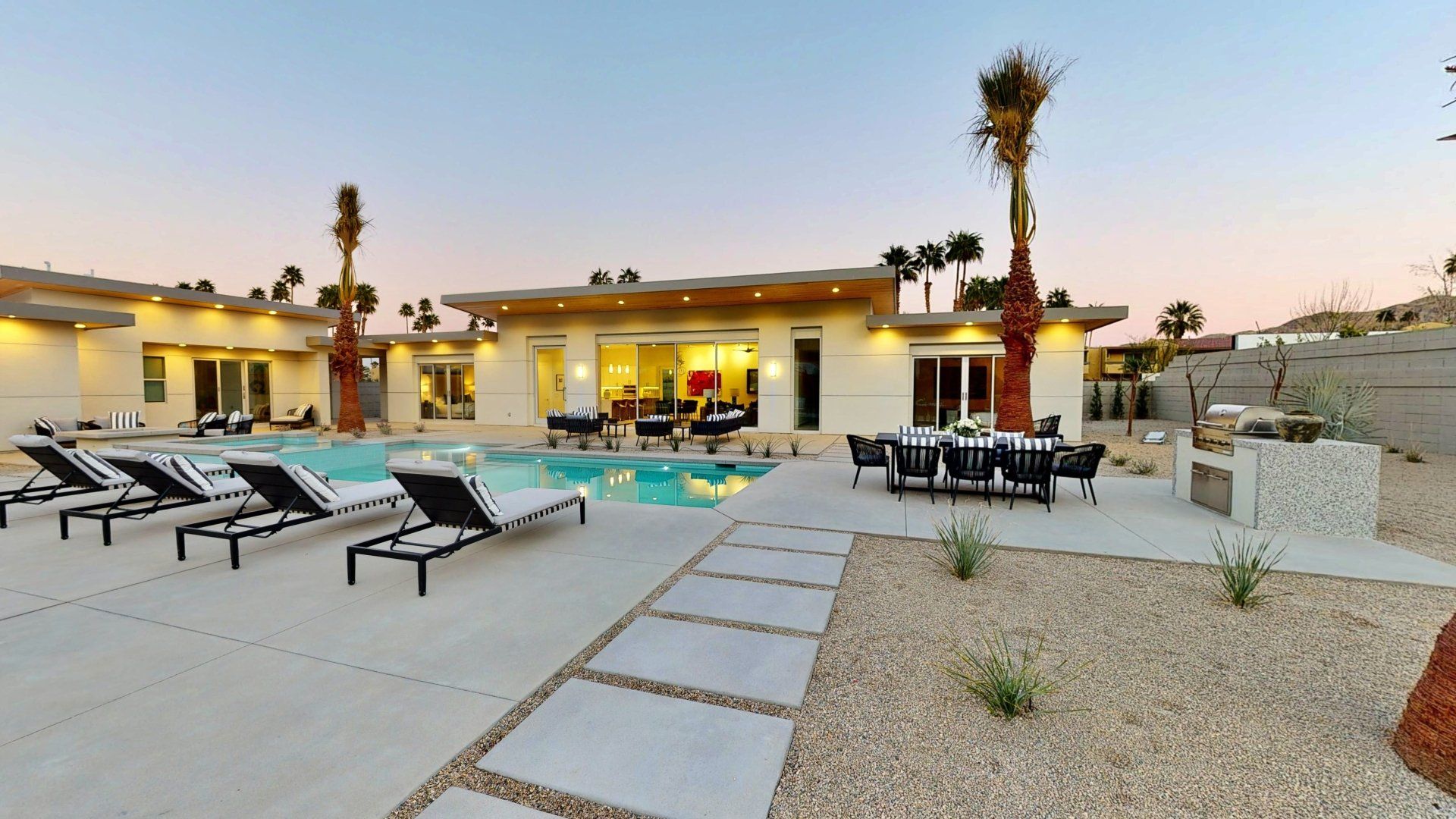 Outdoor pool with lounge chairs