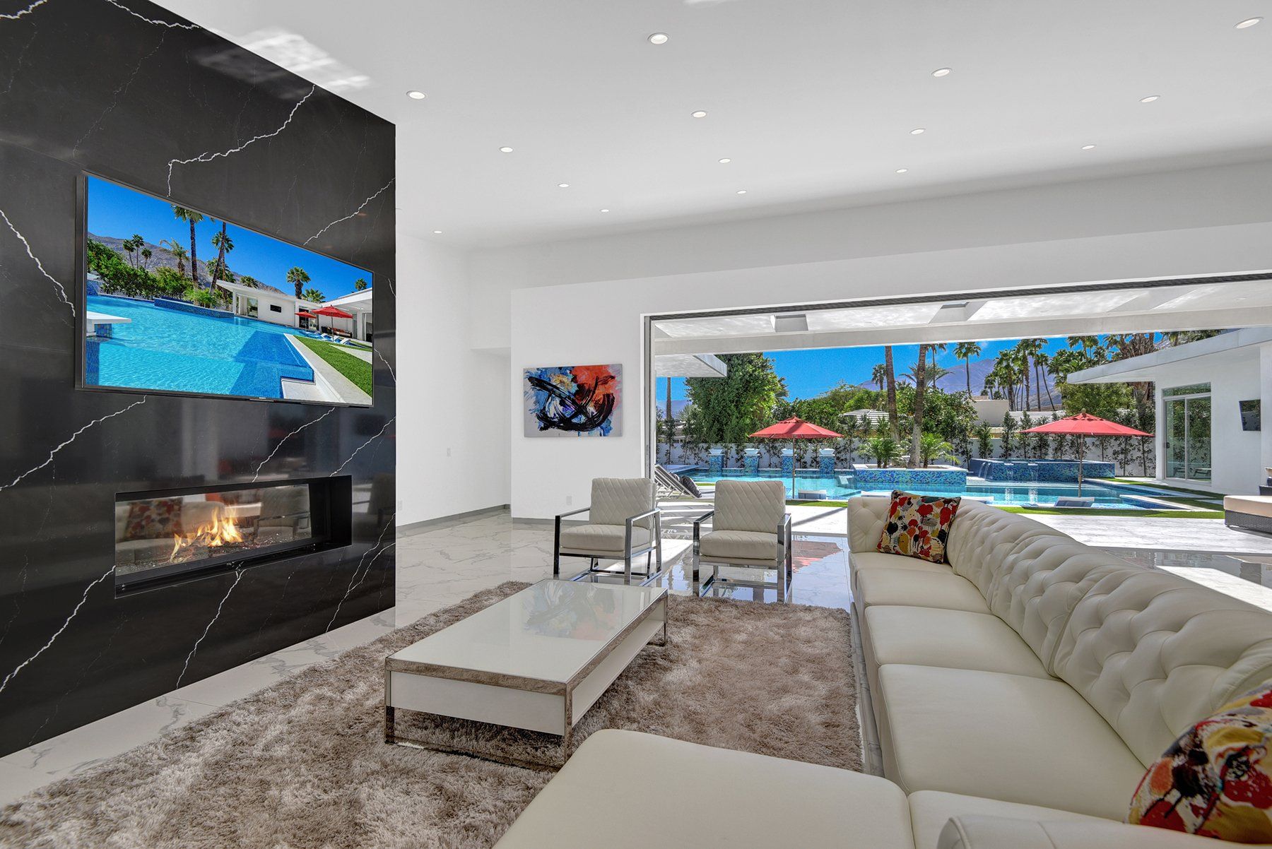 Living room with fireplace to pool straight