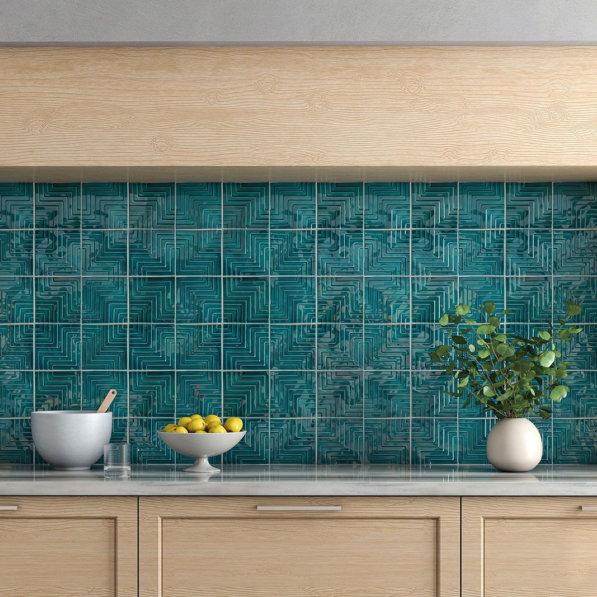 Kitchen backsplash with teal square tiles, wooden cabinets, and countertop with bowls and a vase.
