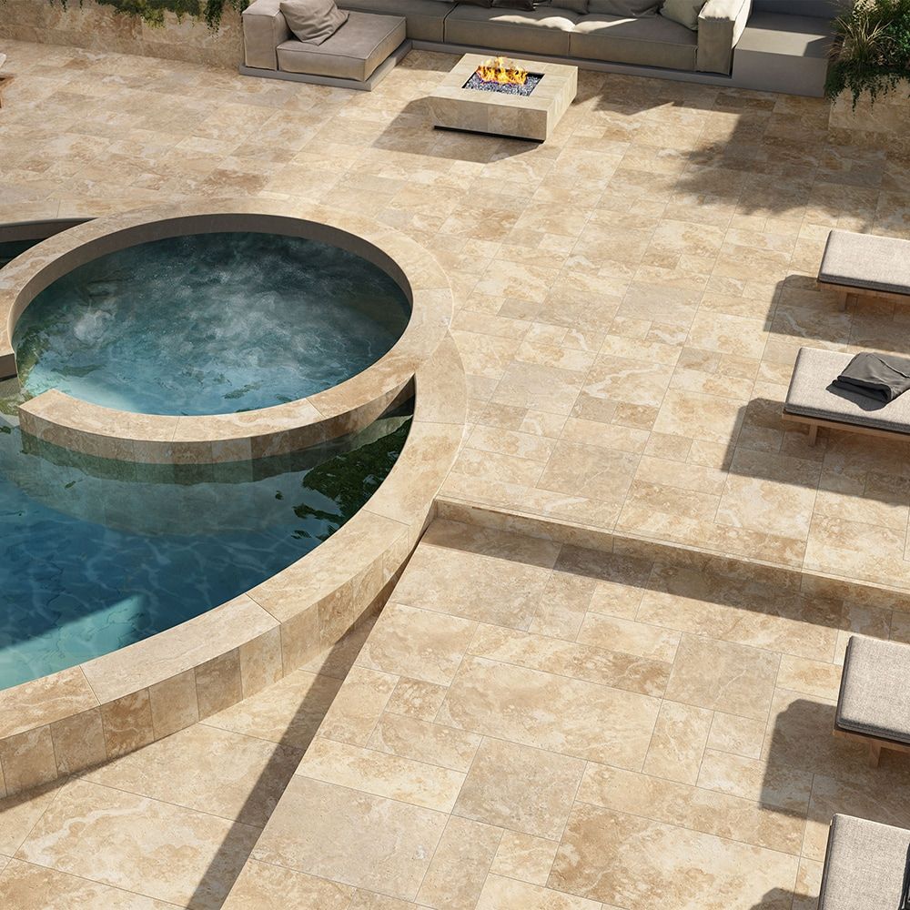 Outdoor patio with pool, hot tub, seating, fire pit, beige tile.