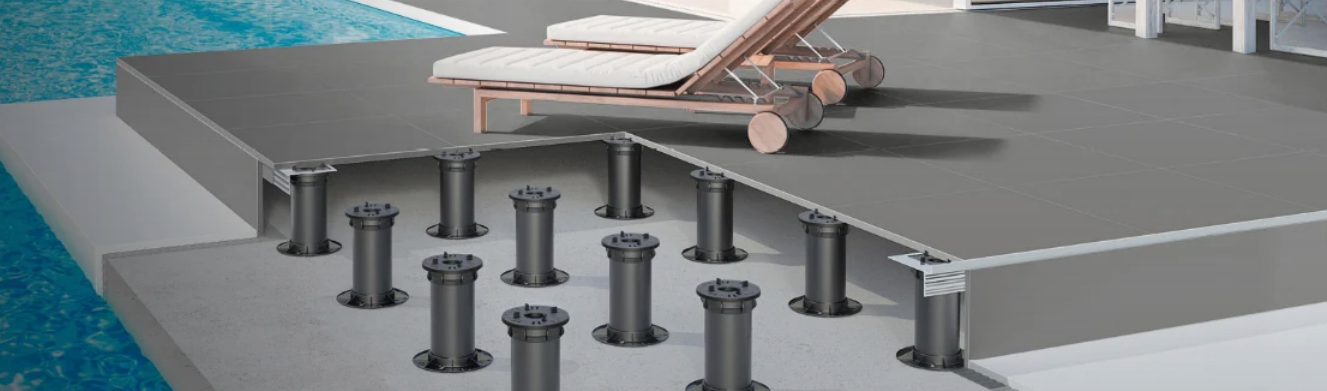 Elevated deck with adjustable supports next to a pool, with a lounge chair visible.