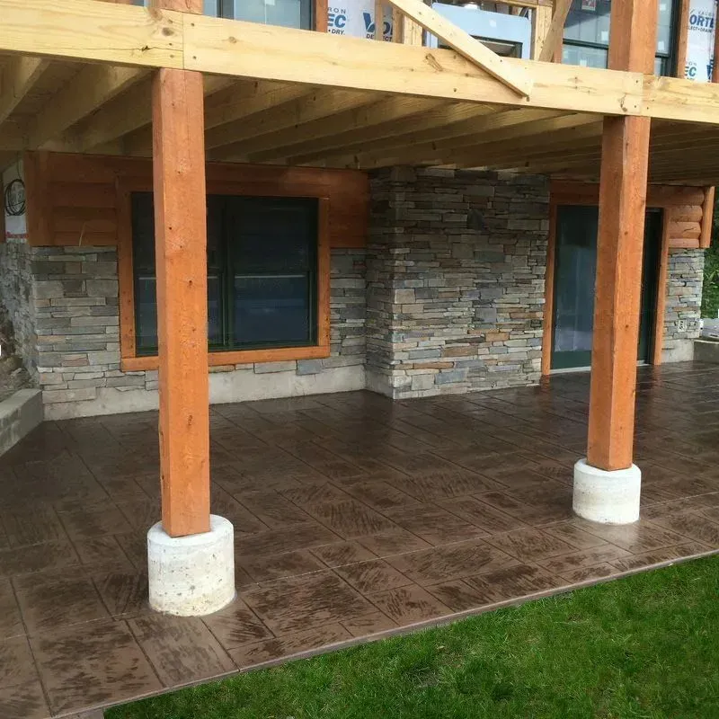 A stone building with a wooden deck underneath it