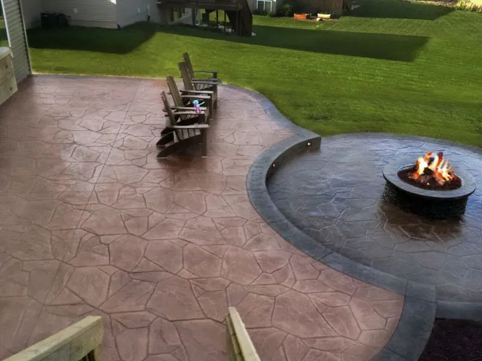 There is a fire pit in the middle of the patio.