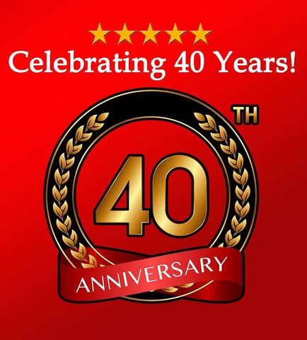 A 40th anniversary logo with a red ribbon