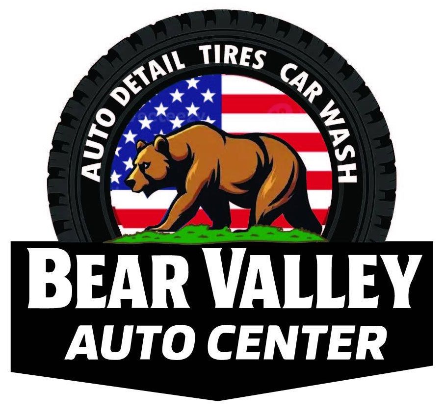 Logo for Bear Valley Auto Center: Brown bear in front of an American flag, surrounded by a tire. 