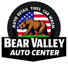 Logo for Bear Valley Auto Center: Brown bear in front of an American flag, surrounded by a tire. 