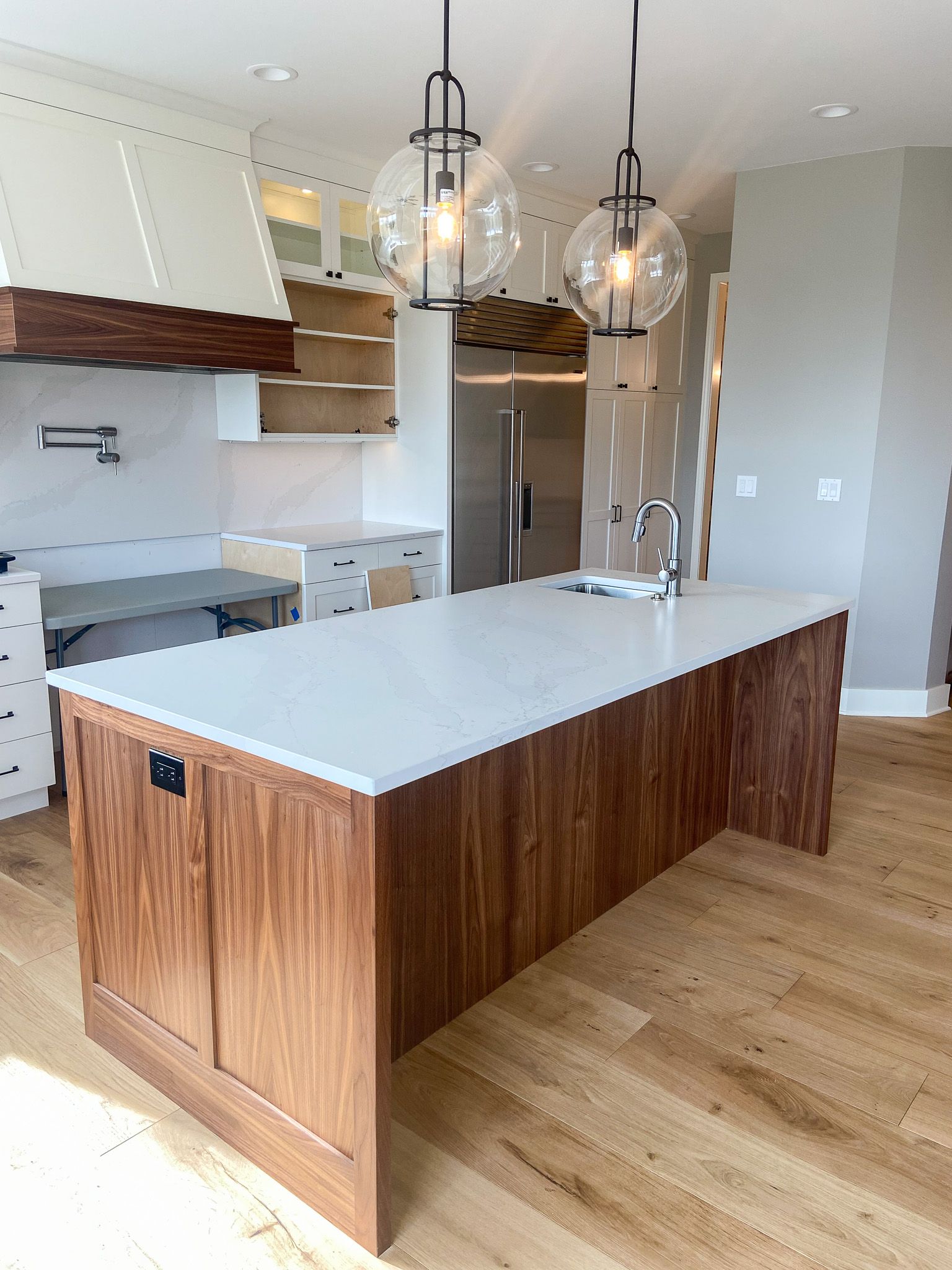 There is a large island in the middle of the kitchen.