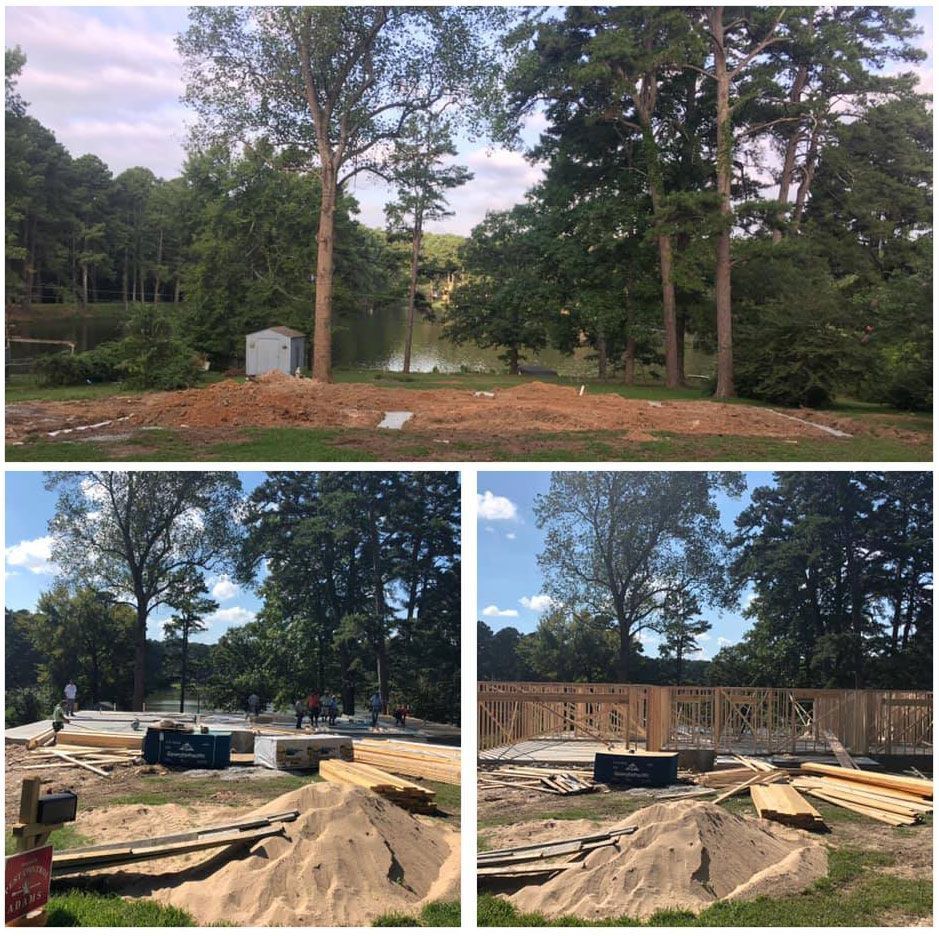 Construction site progress: initial cleared area, foundation, and framing, near trees and water.