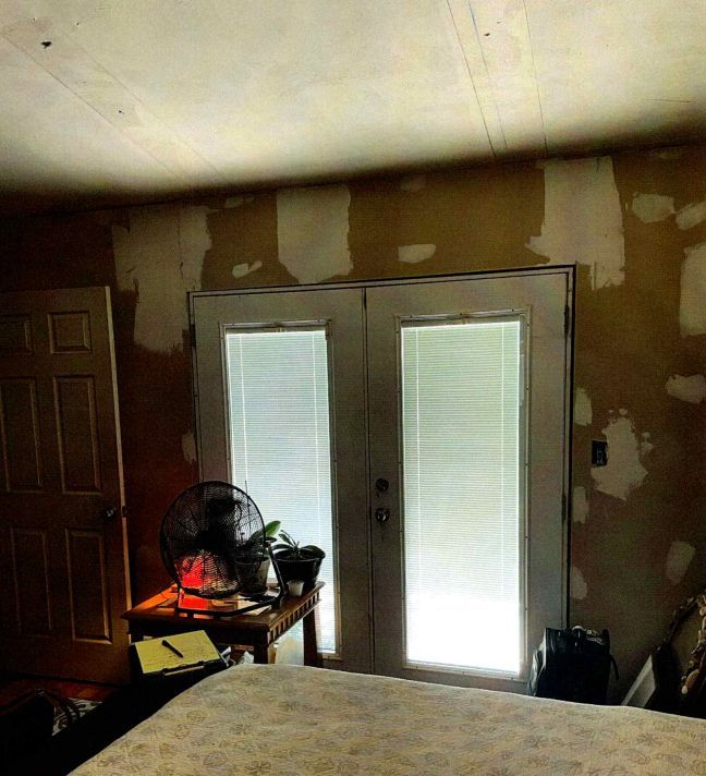 A bedroom requiring a wall enhancement