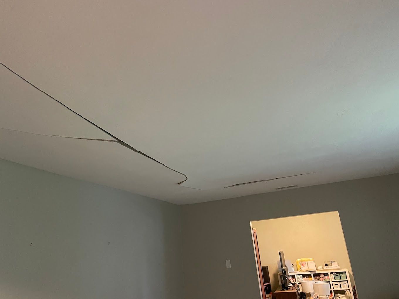 Room with cracked ceiling