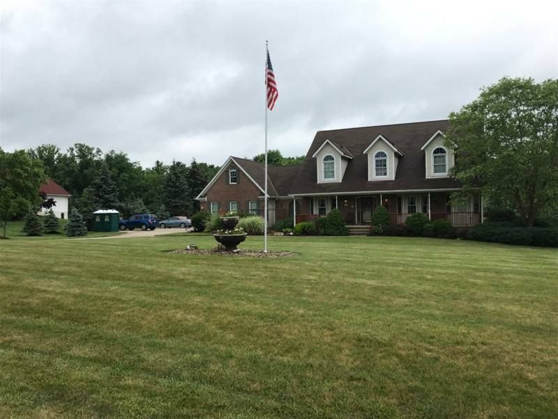 A large house with a flag in front of it
