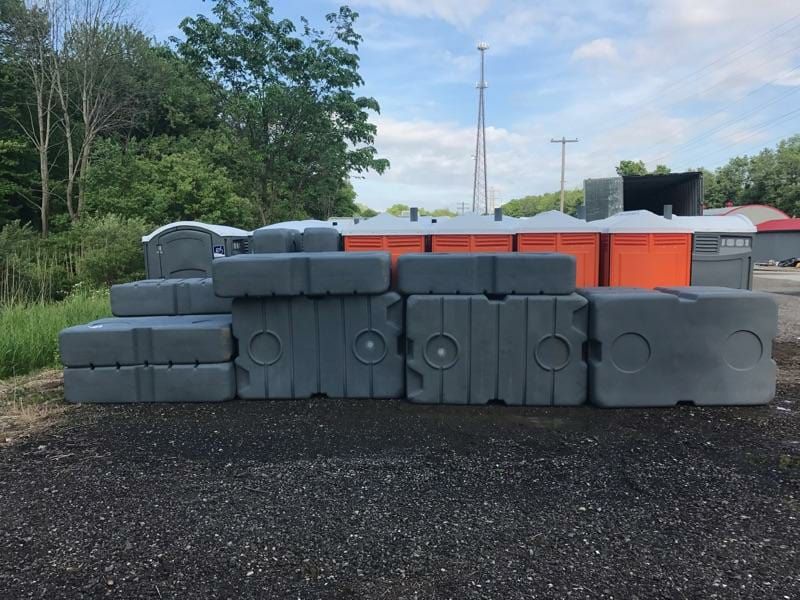 A pile of concrete blocks are stacked on top of each other