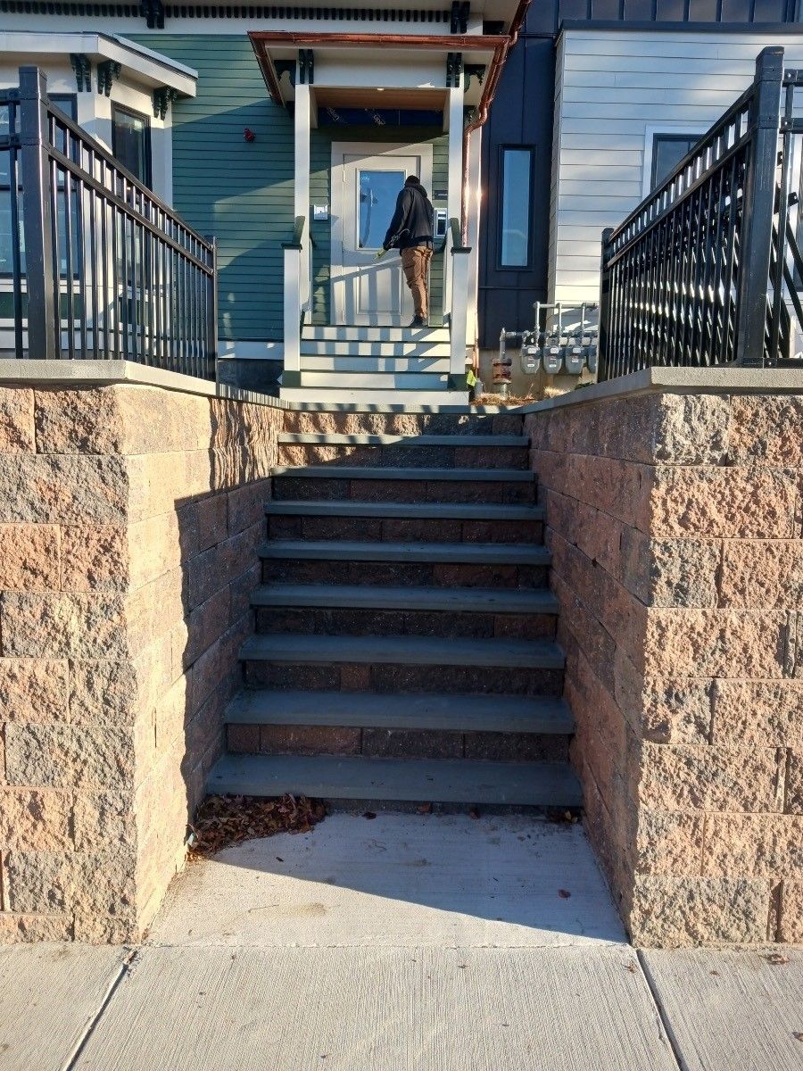 a set of stairs leading up to the front door of a house