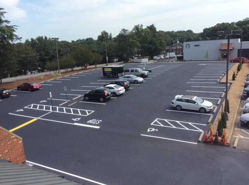 A lot of cars are parked in a parking lot