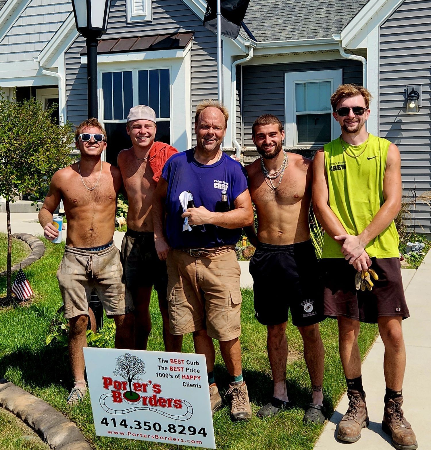 A group of men standing in front of a house with a sign that says porter 's brothers