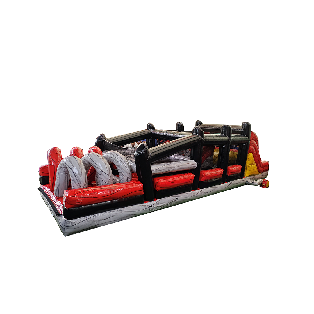 A long, inflatable obstacle course with red, black, and gray sections, including a spiral structure and climbing wall.