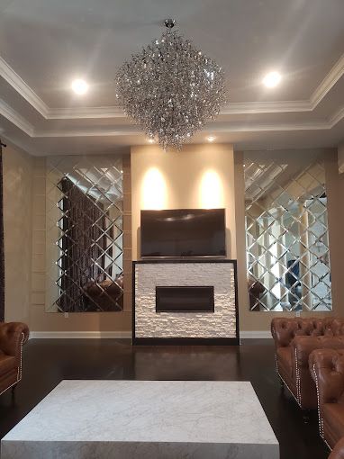 A living room with a fireplace and a flat screen tv