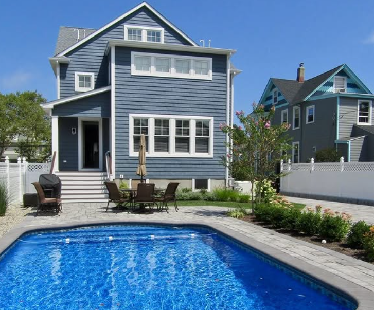 Blue house with pool and patio