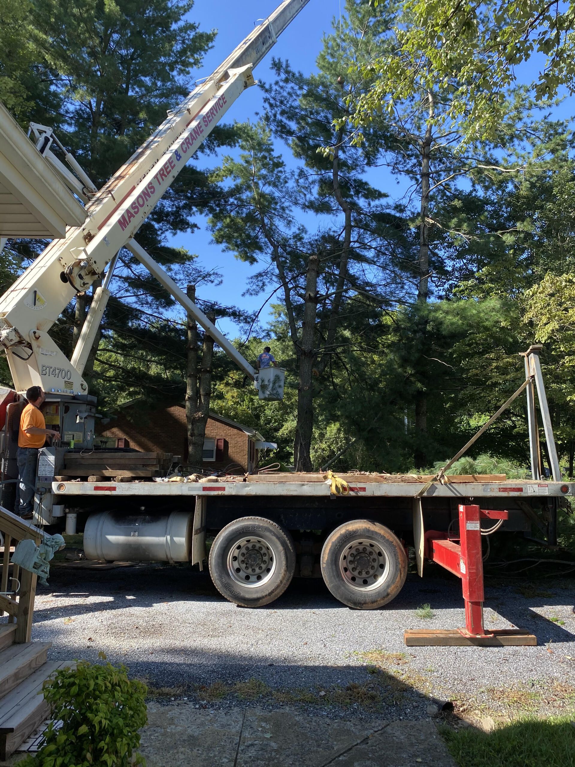 A large crane is on the back of a truck.