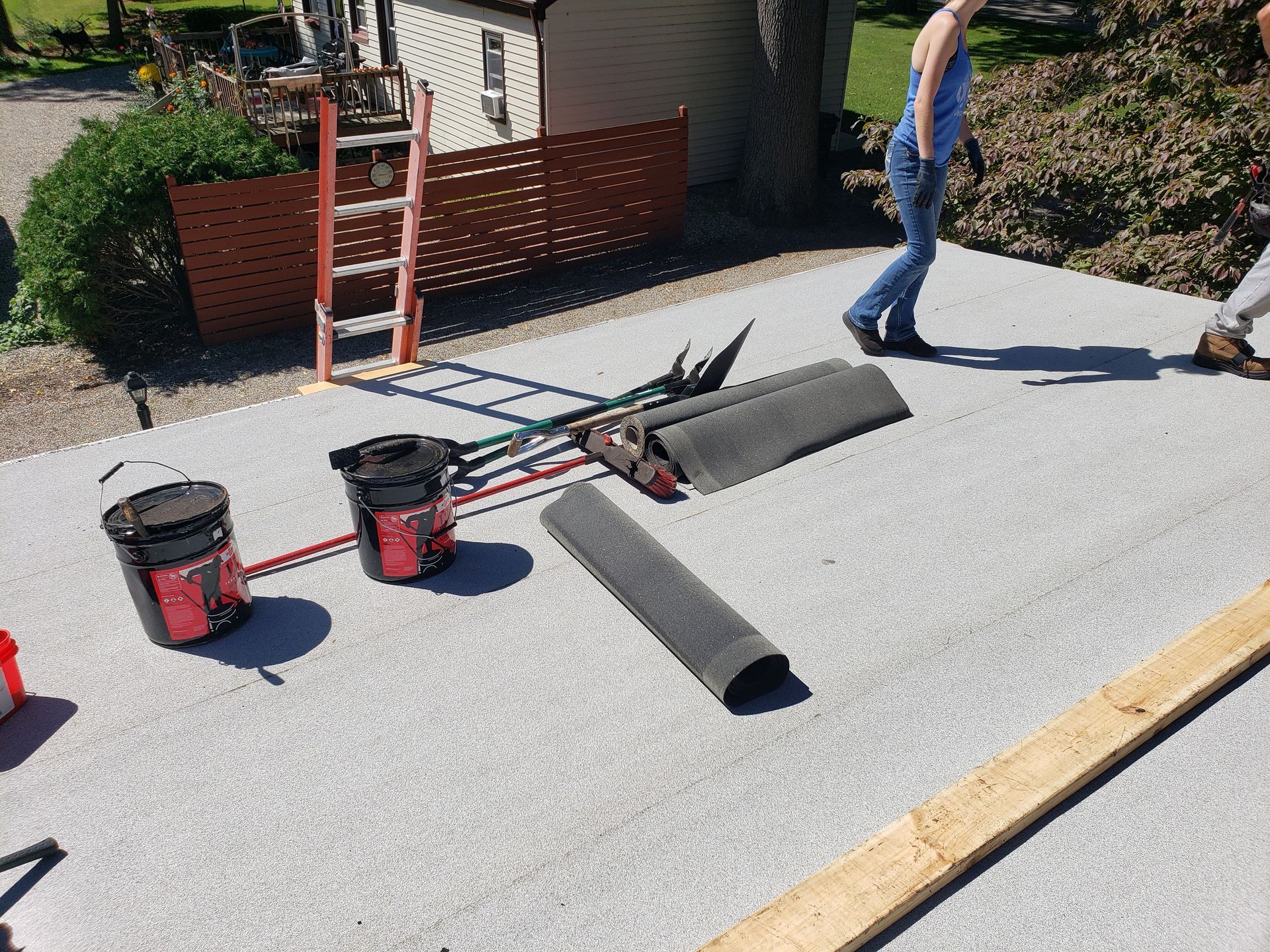 A group of people are working on a roof.