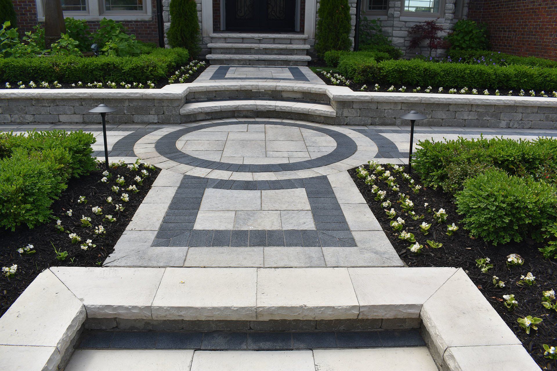 A stone walkway leading to the front door of a house