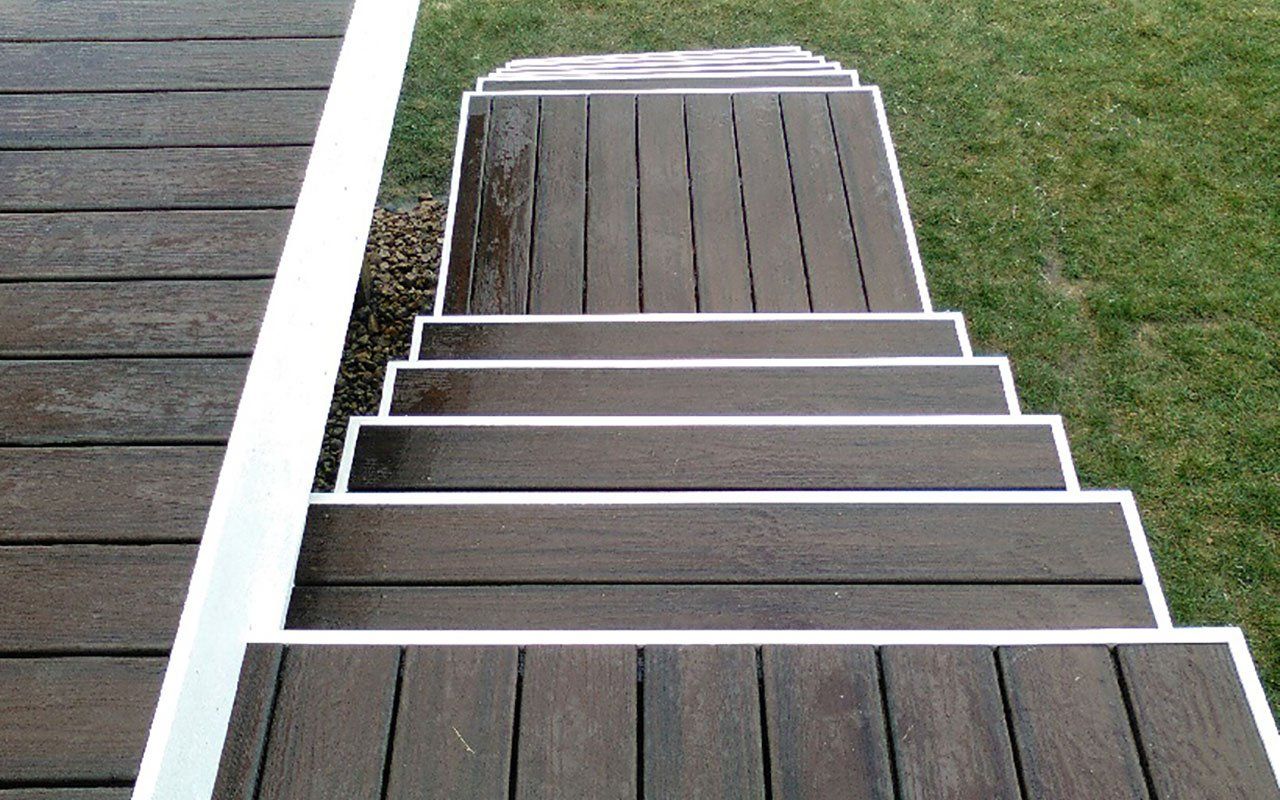 a wooden deck with stairs leading up to it