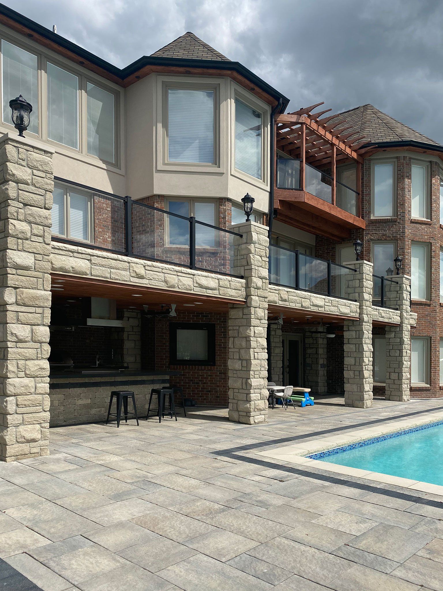 a large house with a swimming pool in front of it