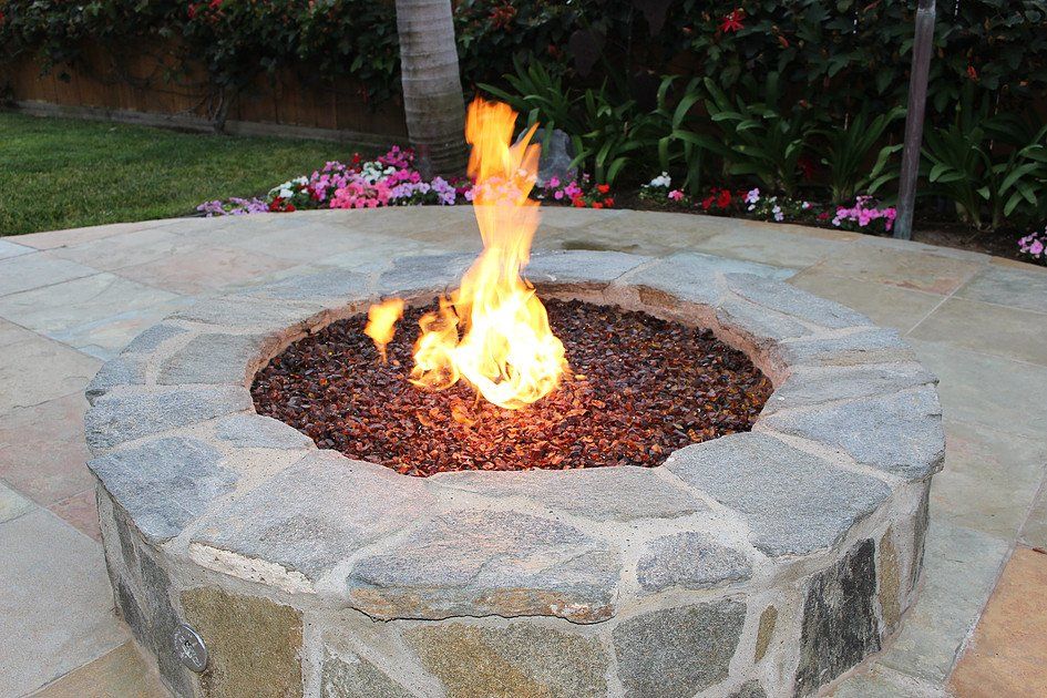 a fire pit with flames coming out of it
