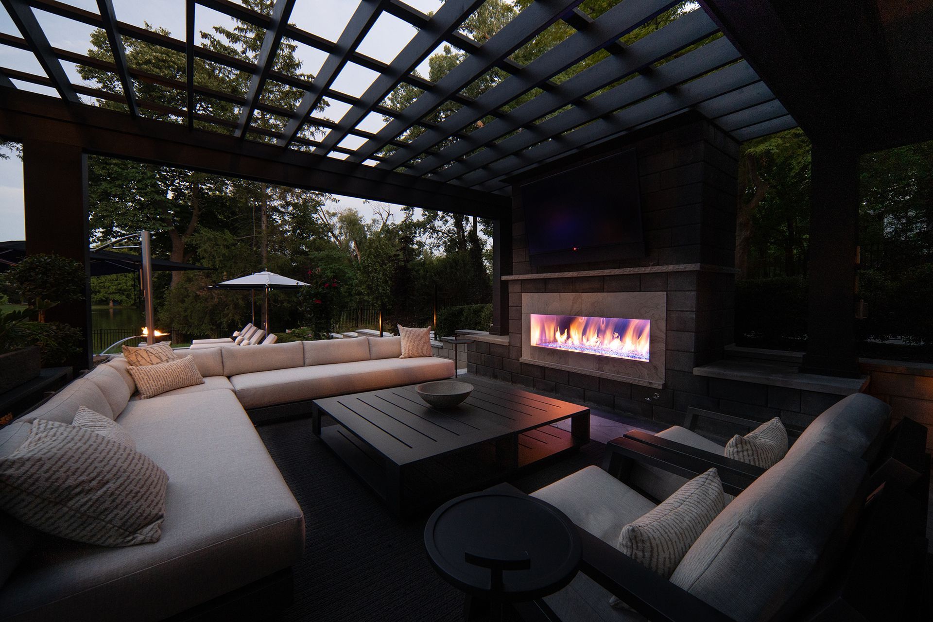 outdoor living area with a fireplace and a couch